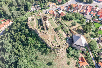 Aerial view of partially restored medieval Filakovo Fulek castle in Southern Slovakia with cannon...