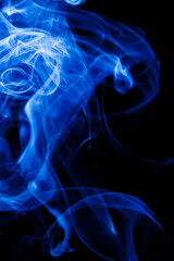 Motion blue smoke on black background.
