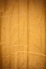 Textured crumpled brown cardboard paper background.