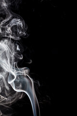 White smoke on black background.