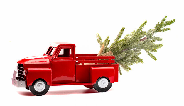 Bright Red Pickup Truck Hauling A Tree For Christmas