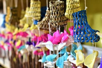 Hanging sea shell wind chimes in outdoor souvenir shop tropical island beach
