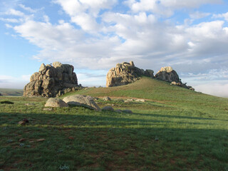 Mogolia fields with mountains in the middle