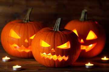 Three Halloween Pumpkins and candles