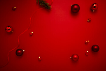 Red Christmas baubles decoration on red background