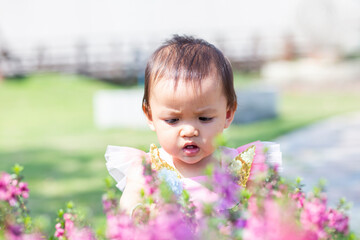 happy girl watching the flower garden