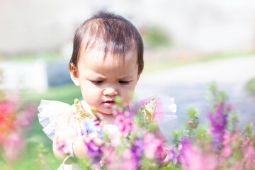 happy girl watching the flower garden