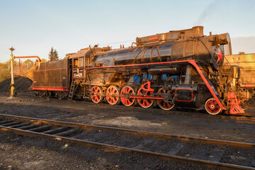Fototapeta na wymiar SORTAVALA, RUSSIA - OCTOBER 07, 2021: Old Soviet cargo steam locomotive L-4429 on Sortavala station on a sunny October morning