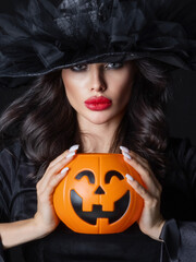 Witch with Halloween pumpkin