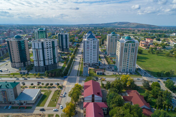 View of the buildings of the "Gudermes City"business center on a sunny September day (aerial photography). Chechen Republic, Russia