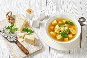 soup of chicken broth with parmesan egg dumplings
