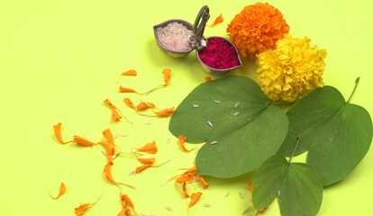 Indian Festival Dussehra, showing golden leaf and flowers on moody background. Greeting card.