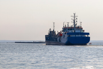 Fototapeta na wymiar Vessel for dredging the seabed, foggy. Baltic Sea