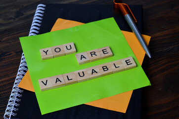 you are valuable, text words typography on wooden background, life and business motivational...