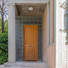 modern design house entrance with glass blocks and solid wood door