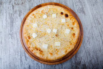 italian pizza on a wooden background with decoration around