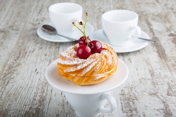 custard dessert with cherry flavor and cherry with a mug