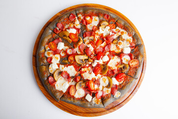 Fototapeta na wymiar italian pizza with black dough on wooden board