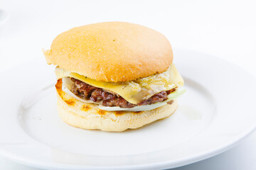 hamburger with cutlet on a plate and white plate