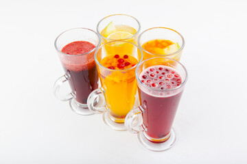 hot berry drinks in a glass glass on a white background