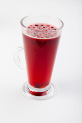 hot berry drinks in a glass glass on a white background