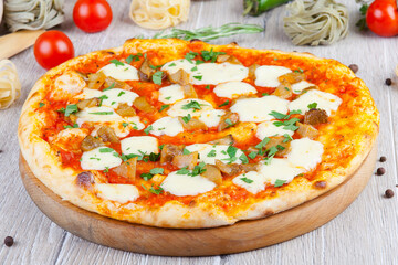 italian pizza on a wooden background with decoration around