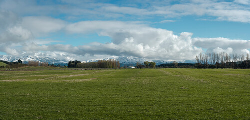 Obraz na płótnie Canvas Panoramic view of farmland in the southern alps located in Canterbury, New Zealand