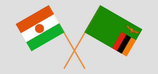 Crossed flags of Niger and the Republic of Zambia. Official colors. Correct proportion