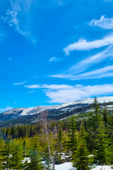 Picturesque view of the snowy mountains against the blue sky.