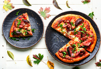 Tasty meat pizza with fig
