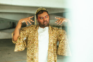 portrait of gay dark skinned indian man in abandoned building