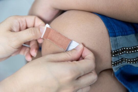Plaster wound dressing on the child's leg