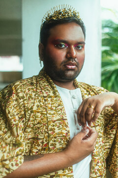 portrait of gay dark skinned indian man in abandoned building