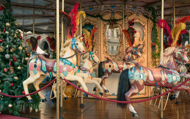 Wooden horses on the Christmas carousel