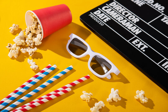 3D glasses, popcorn in a box, clapper board,