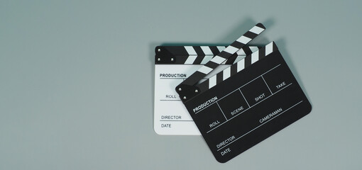 Black and white Clapper board or movie slate on grey background.