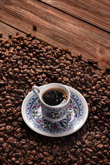 Turkish coffee cup with roasted beans