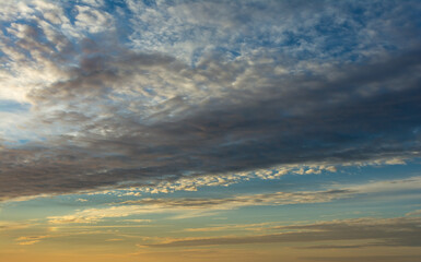 Evening sky with dramatic clouds over the sea. Dramatic sunset over the sea.