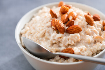 Closeup of oatmeal porridge with almonds