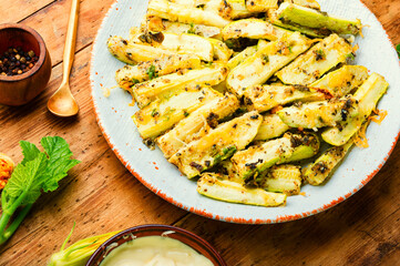 Roasted zucchini sticks with greens