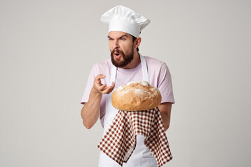 man in chef's uniform fresh bread gourmet baked goods cooking