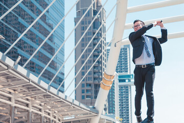 Young successful businessman playing golf with cityscape background. Business target concept.