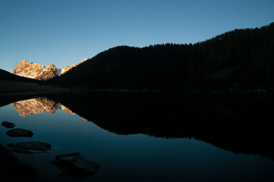 dolomites landscape and reflection on calaita lake