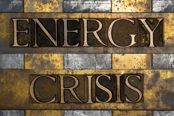 Energy Crisis text on textured grunge copper and vintage gold background
