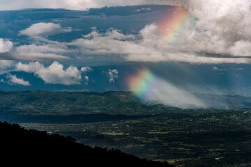 Cloudy sky and rainbow appeared.on the mountain Thailand