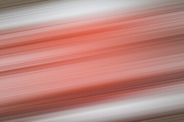 Saturated red, white and brown striped motion blur