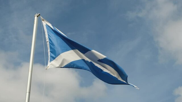 The St. Andrew Cross, national flag of Scotland, flying in the wind,