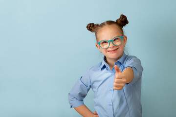 Happy girl with Down syndrome having fun and laughing in the studio