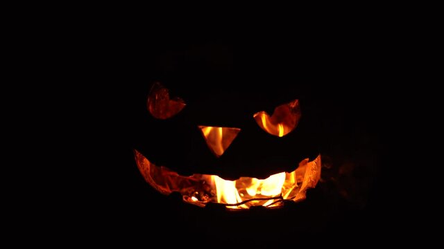 silhouette of a burning pumpkin for halloween