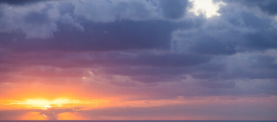 Natural background, stunning view of a dramatic, cloudy sunrise. Romantic sky, copy space, sky replacement, Sardinia, Italy.